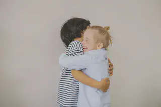 Children Hugging and Laughing