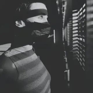 Person Looking Out Slats