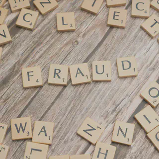 Scrabble Letters Spelling Fraud
