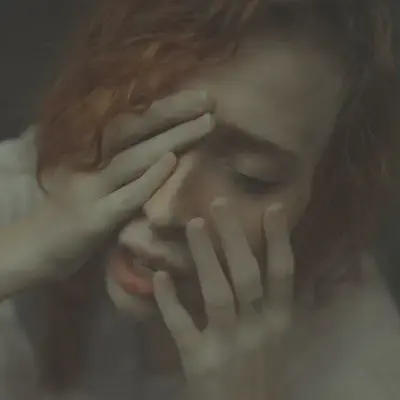 Woman Covering Face